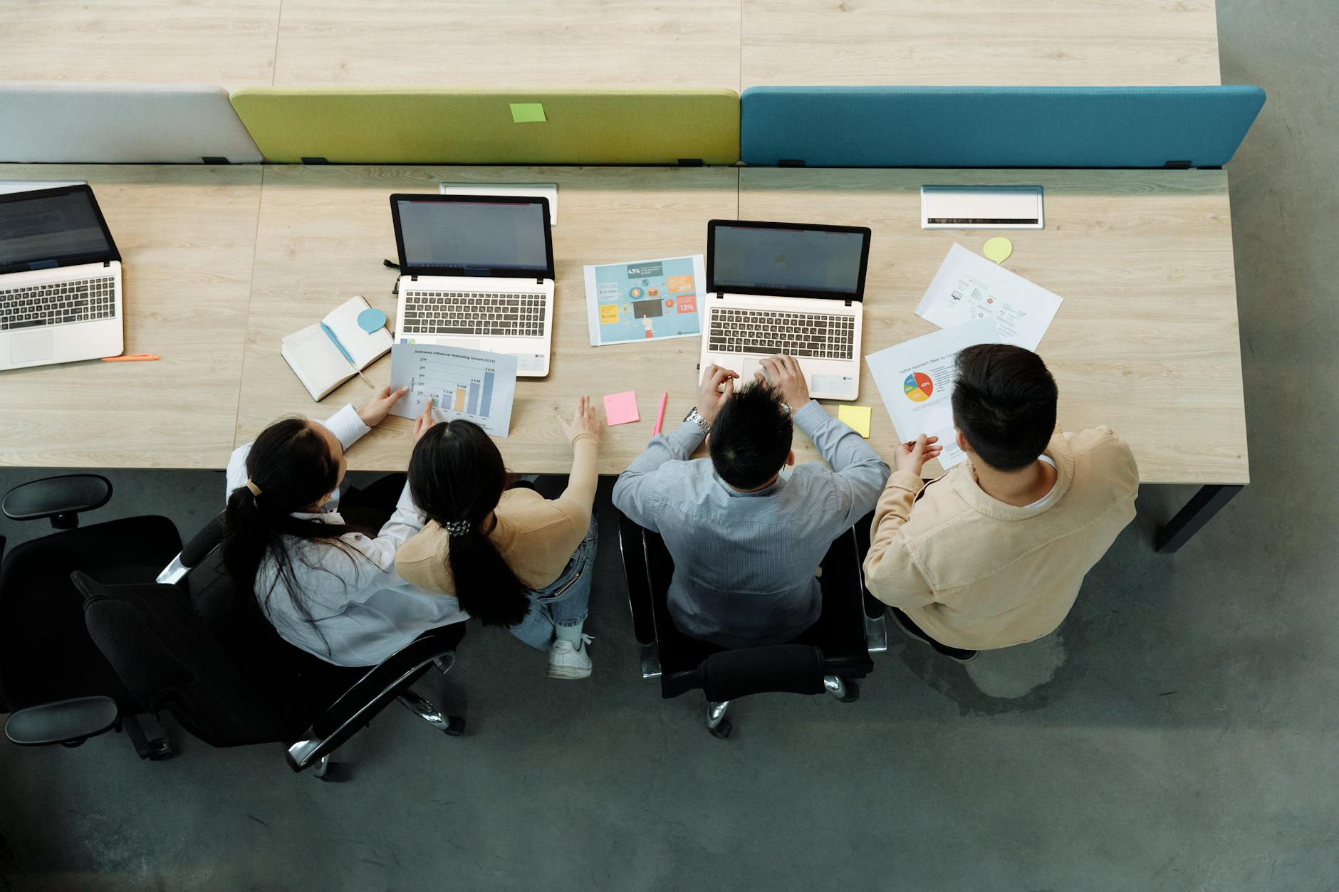 Two people collaborating and sharing a laptop screen